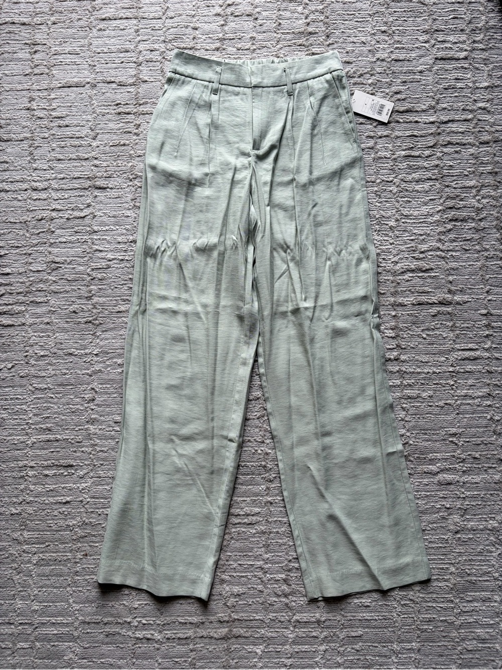 A New Day light green dress pants with pleats. NWT